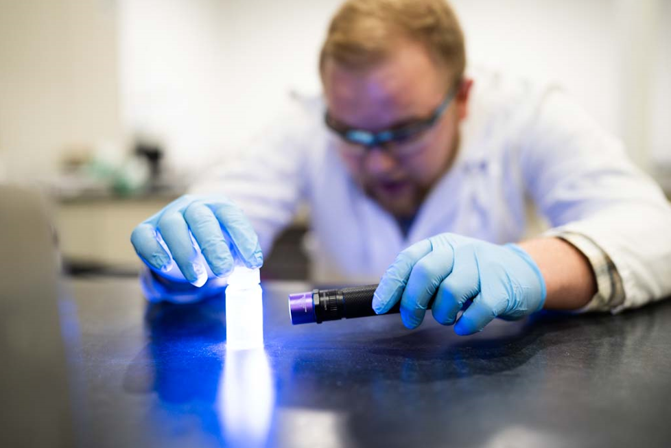 Lubricent Brightview coating solution glowing with blacklight