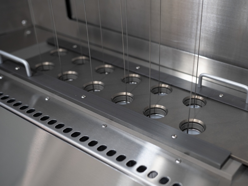 Medical devices being dipped into tubes containing hydrophilic coating solution